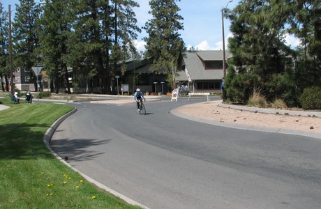 Cyclist navigating roundabout on descent from Mt. Bachelor