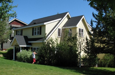 A young lad in Bend Oregon gladly does chores for his parents