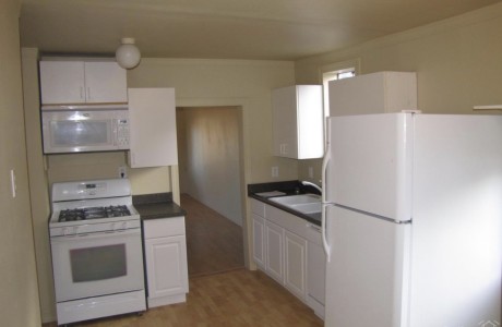 Trendy white kitchen in Bend